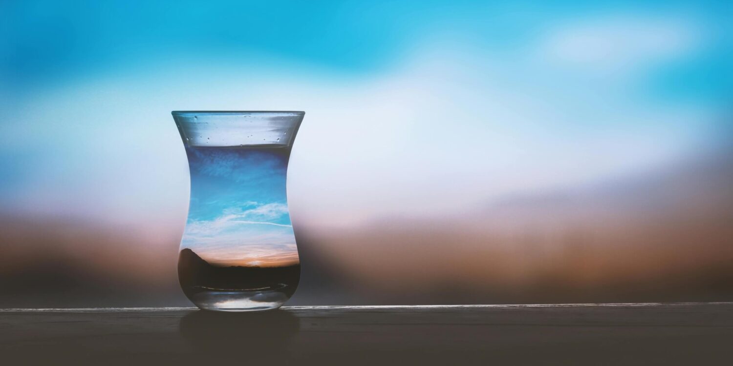 Enhanced water drink product in a glass