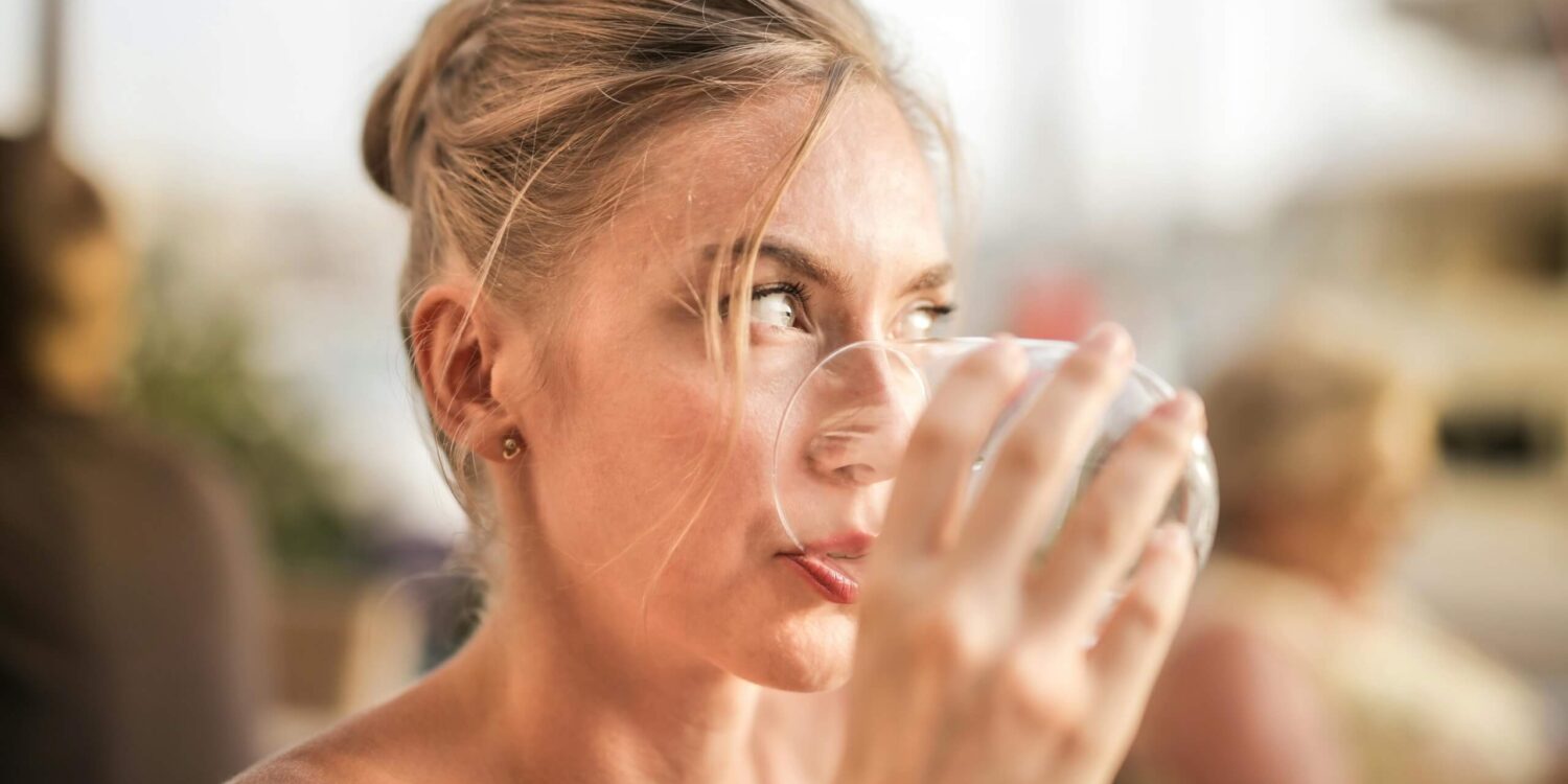 Woman drinking a beauty and health beverage